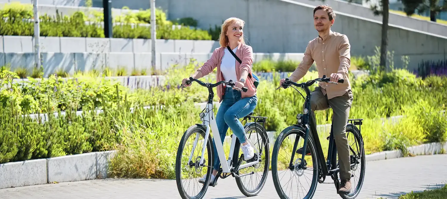 woman and men riding e-bike